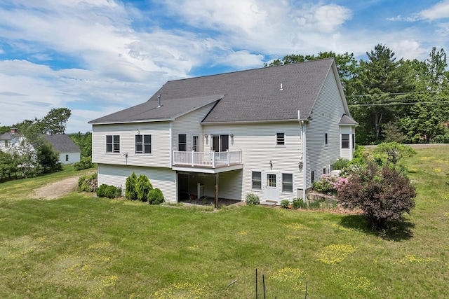 85 Blueberry Hill Rd, Meredith, NH 03253 - back of house with a yard, a shingled roof, and a wooden deck