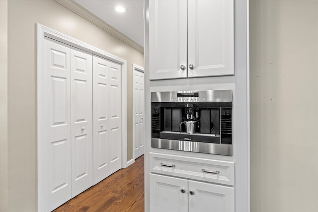 104 Windsor Dr, Auburn, NH 03032 - kitchen featuring crown molding, dark wood-type flooring, white cabinetry, recessed lighting, and stainless steel oven
