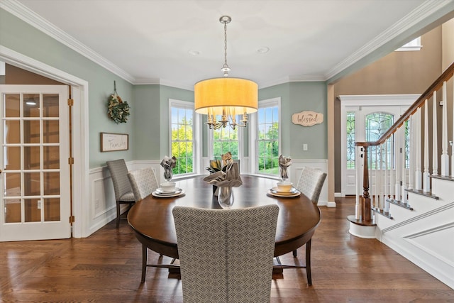 104 Windsor Dr, Auburn, NH 03032 - dining space featuring a wainscoted wall, stairway, a chandelier, ornamental molding, and dark wood finished floors