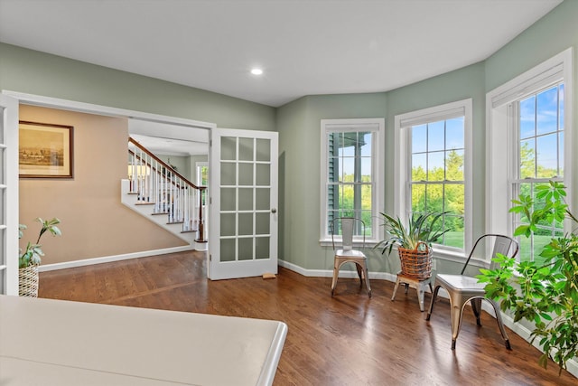 104 Windsor Dr, Auburn, NH 03032 - sitting room with stairs, wood finished floors, and recessed lighting