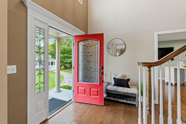 104 Windsor Dr, Auburn, NH 03032 - foyer entrance featuring wood finished floors, stairway, and a towering ceiling
