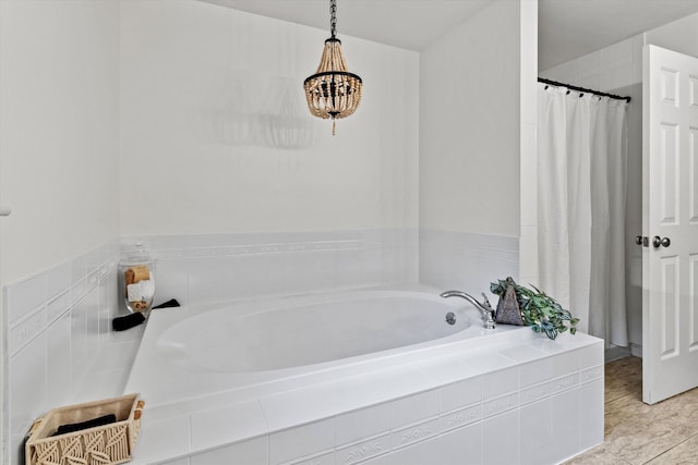 104 Windsor Dr, Auburn, NH 03032 - full bath with a bath, a chandelier, a shower with shower curtain, and tile patterned flooring