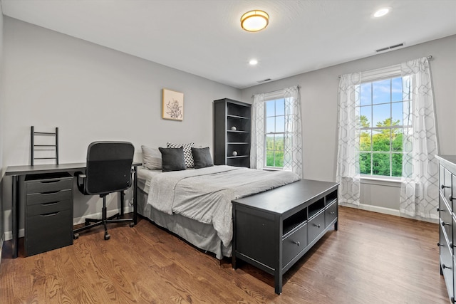 104 Windsor Dr, Auburn, NH 03032 - bedroom with multiple windows, wood finished floors, and recessed lighting