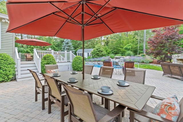 104 Windsor Dr, Auburn, NH 03032 - view of patio / terrace featuring outdoor dining area, a deck, an outdoor pool, and a storage unit