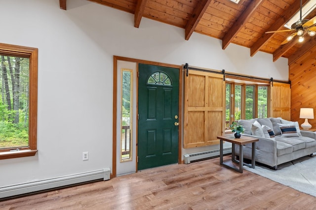 26 Old Mill Rd, Ossipee, NH 03890 - entrance foyer featuring a baseboard heating unit, a barn door, light wood-type flooring, a wood ceiling with exposed beams, and a ceiling fan