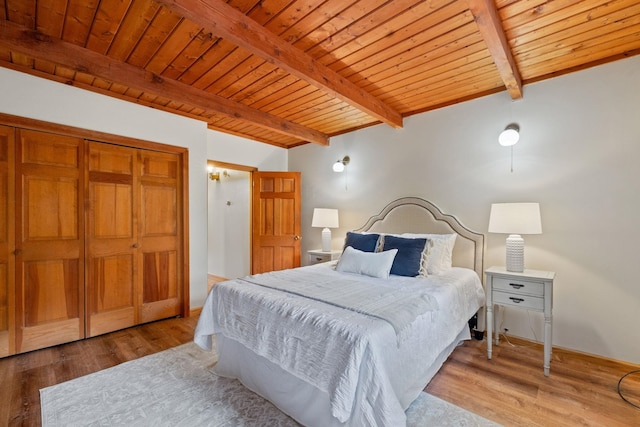 26 Old Mill Rd, Ossipee, NH 03890 - bedroom featuring a wooden ceiling with exposed beams and wood finished floors