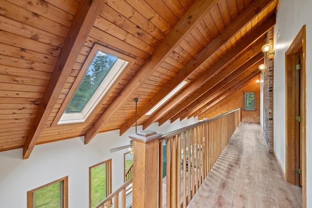 26 Old Mill Rd, Ossipee, NH 03890 - corridor with a skylight, light wood-style floors, and a wooden ceiling with exposed beams