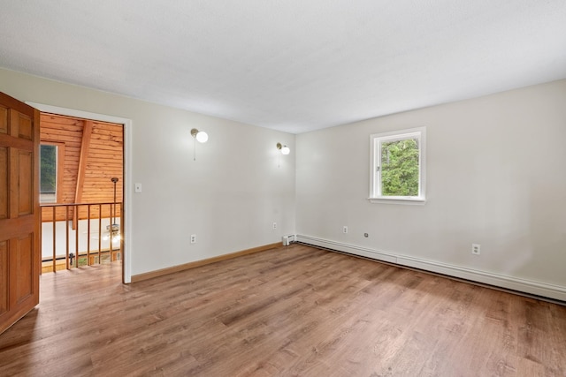 26 Old Mill Rd, Ossipee, NH 03890 - unfurnished room featuring baseboard heating and light wood finished floors