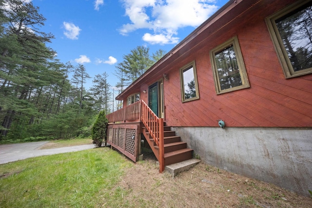 26 Old Mill Rd, Ossipee, NH 03890 - view of home's exterior featuring stairs and a lawn