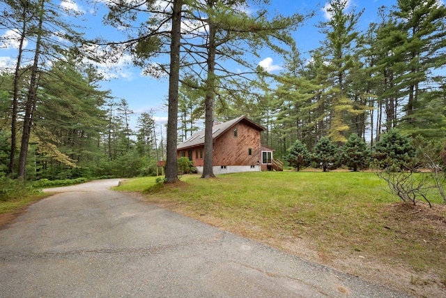 26 Old Mill Rd, Ossipee, NH 03890 - view of side of home with a lawn