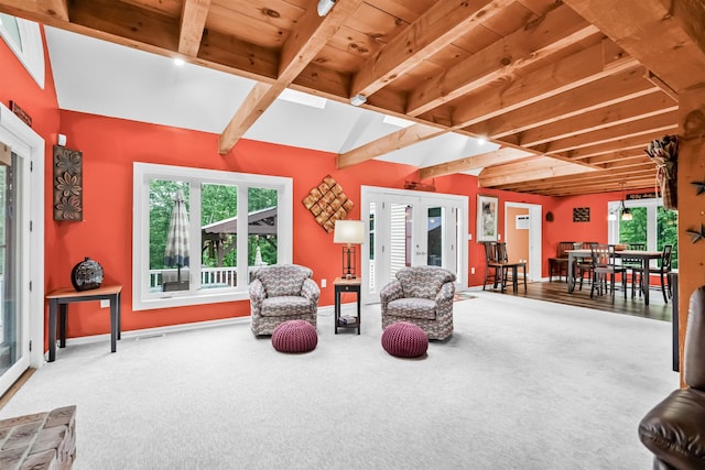 329 Peverly Rd, Northfield, NH 03276 - living area featuring beam ceiling, carpet floors, and plenty of natural light