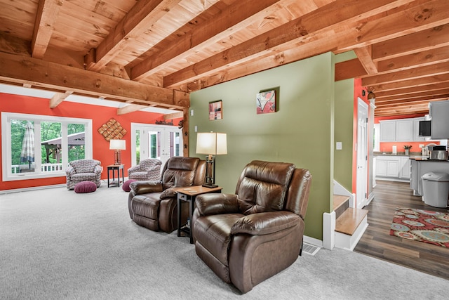 329 Peverly Rd, Northfield, NH 03276 - living area featuring dark carpet, french doors, and a wooden ceiling with exposed beams