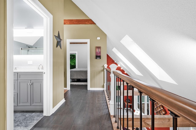 329 Peverly Rd, Northfield, NH 03276 - hall with a skylight, dark wood-style flooring, and vaulted ceiling