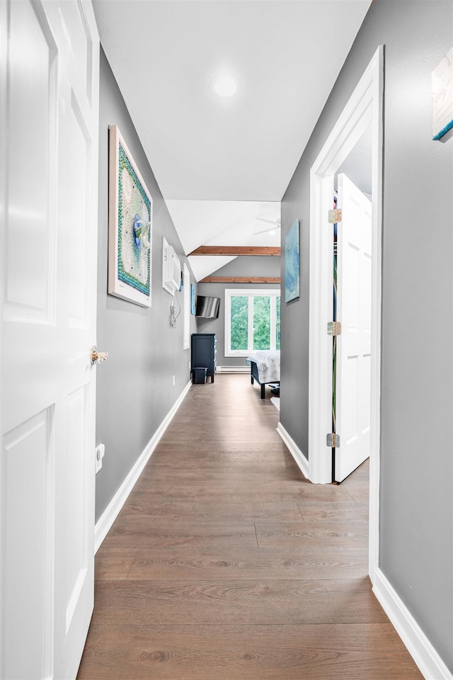 329 Peverly Rd, Northfield, NH 03276 - corridor featuring wood finished floors, vaulted ceiling, and a wall mounted AC