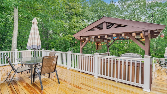329 Peverly Rd, Northfield, NH 03276 - wooden terrace featuring outdoor dining space and view of wooded area