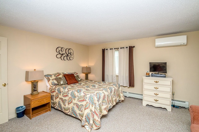 11E- Seasons Of Attitash Rd Unit E, Bartlett, NH 03812 - bedroom featuring a wall mounted AC, baseboard heating, and carpet