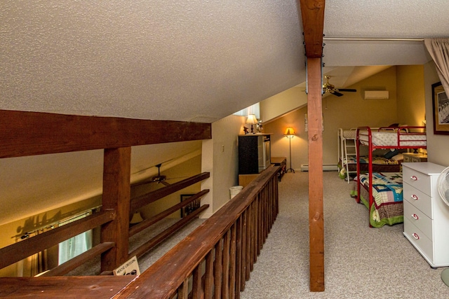11E- Seasons Of Attitash Rd Unit E, Bartlett, NH 03812 - hallway with carpet, a textured ceiling, baseboard heating, and lofted ceiling