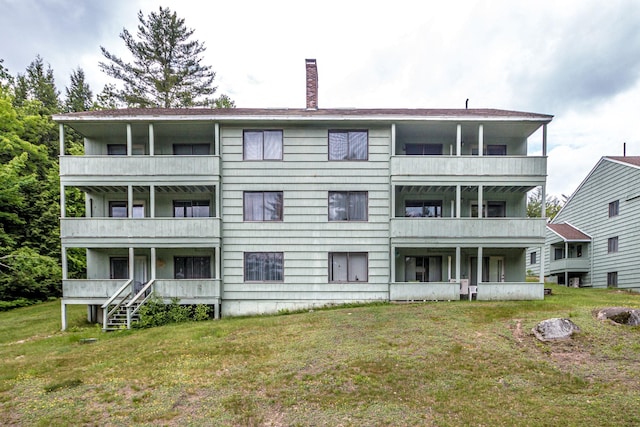 11E- Seasons Of Attitash Rd Unit E, Bartlett, NH 03812 - back of property featuring a chimney, a balcony, and a yard
