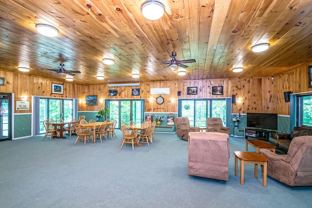11E- Seasons Of Attitash Rd Unit E, Bartlett, NH 03812 - living area featuring wooden walls, a ceiling fan, plenty of natural light, carpet floors, and wood ceiling