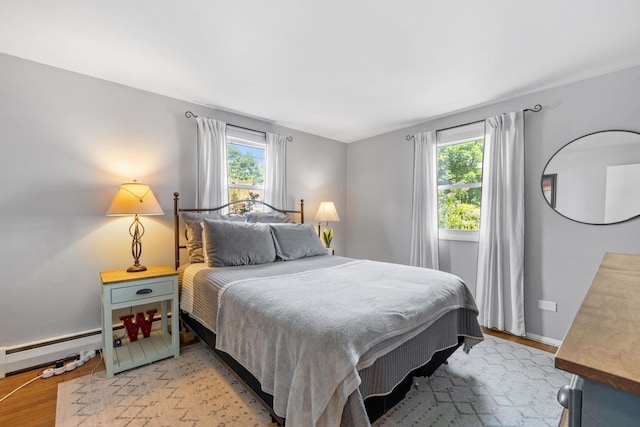 46 E Diane Dr, Keene, NH 03431 - bedroom with multiple windows, light wood-type flooring, and a baseboard heating unit