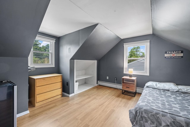 46 E Diane Dr, Keene, NH 03431 - bedroom featuring baseboard heating, lofted ceiling, light wood-type flooring, and multiple windows