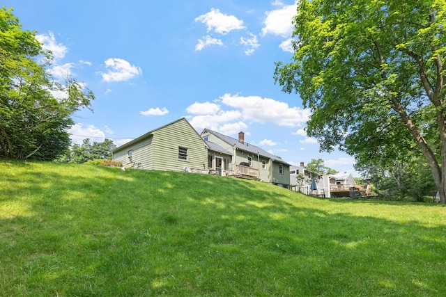 46 E Diane Dr, Keene, NH 03431 - back of house featuring a deck, a lawn, and a chimney