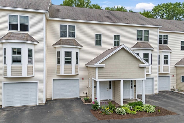 243 Drakeside Rd Unit 7, Hampton, NH 03842 - view of property with driveway and a garage