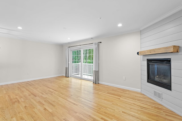 243 Drakeside Rd Unit 7, Hampton, NH 03842 - unfurnished living room with crown molding, a large fireplace, light wood-style floors, and recessed lighting