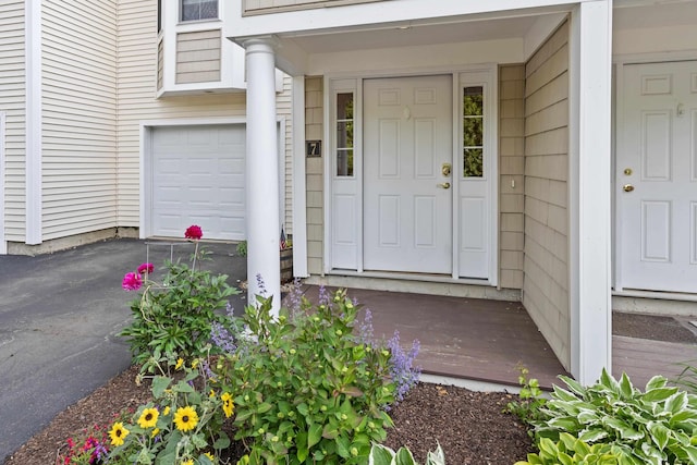 243 Drakeside Rd Unit 7, Hampton, NH 03842 - doorway to property featuring asphalt driveway and a garage
