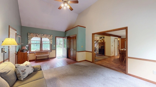 114 Snow Pond Rd, Concord, NH 03301 - carpeted living room featuring high vaulted ceiling, ceiling fan, a fireplace, and tile patterned floors