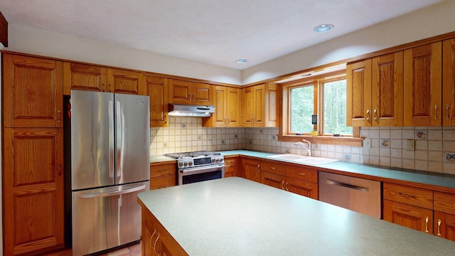 114 Snow Pond Rd, Concord, NH 03301 - kitchen with appliances with stainless steel finishes, brown cabinets, and recessed lighting