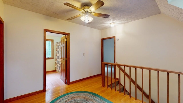 114 Snow Pond Rd, Concord, NH 03301 - corridor featuring a textured ceiling and light wood-style floors