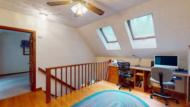 114 Snow Pond Rd, Concord, NH 03301 - home office with a skylight, wood finished floors, ceiling fan, and vaulted ceiling