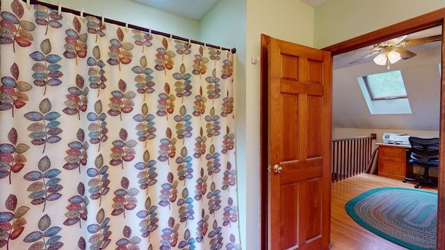 114 Snow Pond Rd, Concord, NH 03301 - full bath featuring a skylight, a ceiling fan, a shower with curtain, and wood finished floors
