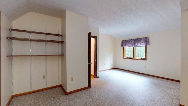 114 Snow Pond Rd, Concord, NH 03301 - unfurnished bedroom featuring lofted ceiling, carpet flooring, and a textured ceiling