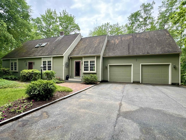 114 Snow Pond Rd, Concord, NH 03301 - view of front of home with driveway, a garage, and a chimney