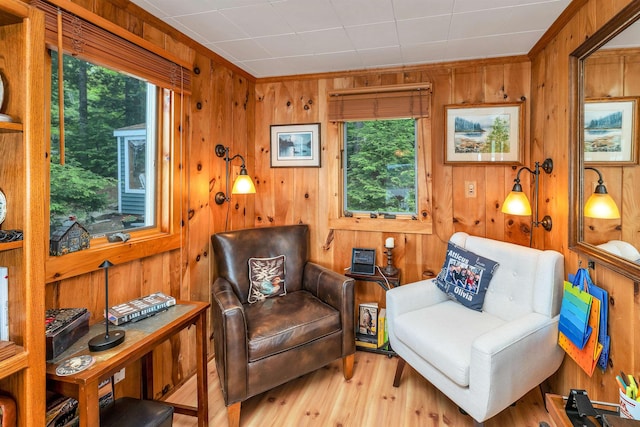 352 S Shore Rd, New Durham, NH 03855 - sitting room featuring wood finished floors, wooden walls, and ornamental molding