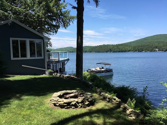 352 S Shore Rd, New Durham, NH 03855 - dock area featuring a fire pit, a forest view, a water view, and a yard
