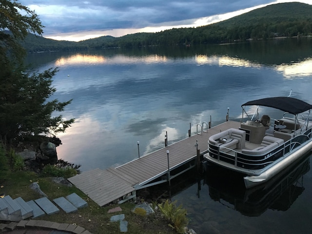 352 S Shore Rd, New Durham, NH 03855 - water view featuring a dock and a mountainous background
