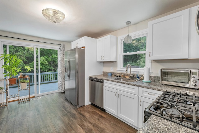 44A Windham Rd, Hudson, NH 03051 - kitchen featuring stainless steel appliances, white cabinets, dark wood-type flooring, and dark stone countertops