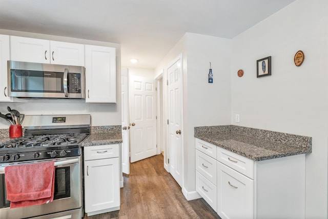 44A Windham Rd, Hudson, NH 03051 - kitchen with appliances with stainless steel finishes, wood finished floors, white cabinetry, dark stone countertops, and recessed lighting