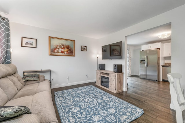 44A Windham Rd, Hudson, NH 03051 - living area with dark wood-style flooring and a glass covered fireplace