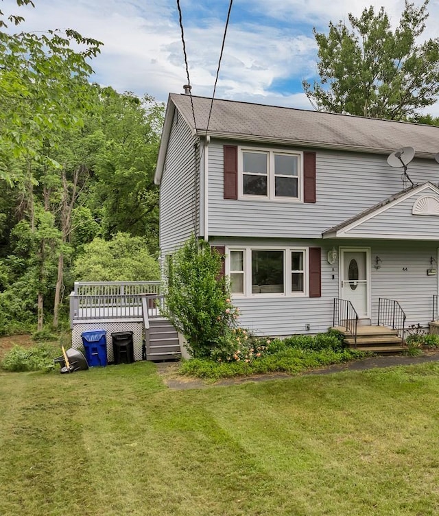 44A Windham Rd, Hudson, NH 03051 - view of front of house featuring a front lawn, a shingled roof, and a deck