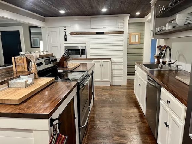 33 Newbury Heights Rd, Newbury, NH 03255 - kitchen with butcher block counters, appliances with stainless steel finishes, dark wood-style floors, a center island, and recessed lighting