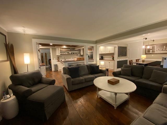 33 Newbury Heights Rd, Newbury, NH 03255 - living room with dark wood-style floors and crown molding