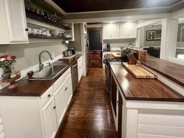 33 Newbury Heights Rd, Newbury, NH 03255 - kitchen with wood counters, dark wood-style floors, stainless steel appliances, and white cabinets