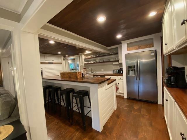 33 Newbury Heights Rd, Newbury, NH 03255 - kitchen featuring stainless steel refrigerator with ice dispenser, open shelves, a kitchen breakfast bar, white cabinets, and recessed lighting