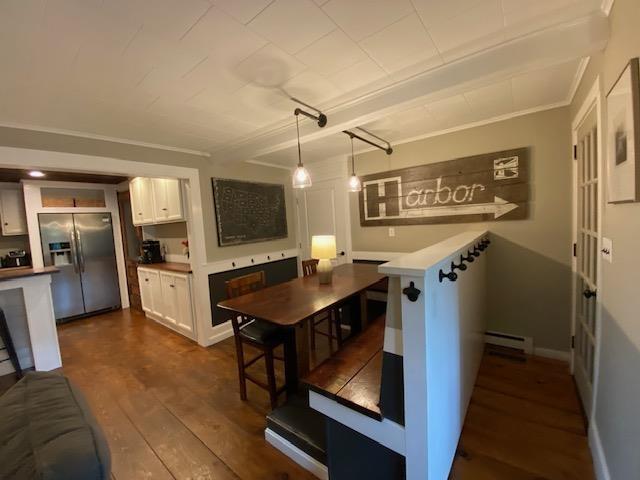 33 Newbury Heights Rd, Newbury, NH 03255 - kitchen with stainless steel fridge with ice dispenser, white cabinetry, oven, dark wood finished floors, and a baseboard heating unit
