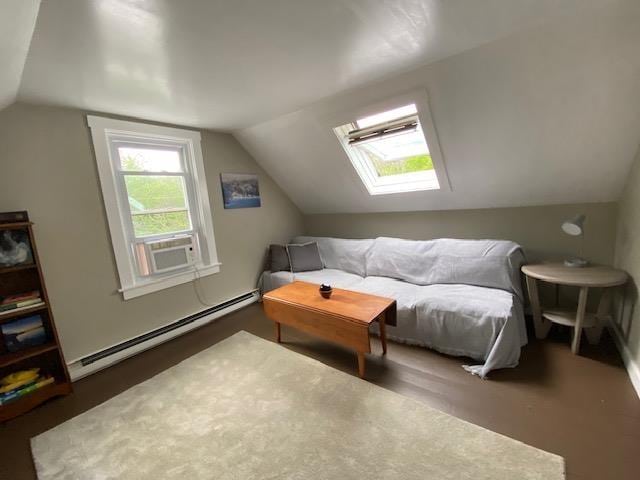 33 Newbury Heights Rd, Newbury, NH 03255 - additional living space with a baseboard heating unit, lofted ceiling, a skylight, and wood finished floors