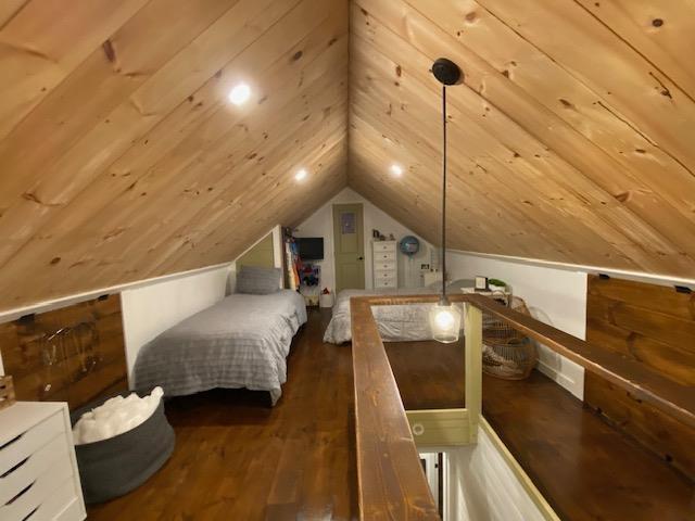 33 Newbury Heights Rd, Newbury, NH 03255 - bedroom with dark wood-style floors, vaulted ceiling, and wooden ceiling